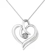 Diamond Heart Swirl Pendant In 14K White Gold (1/7 Ct. Tw.)