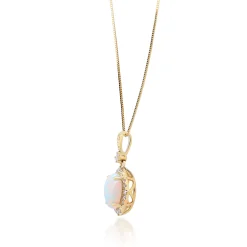Opal And Diamond Oval-Shaped Pendant In 10K Yellow Gold (1/5 Ct. Tw.)