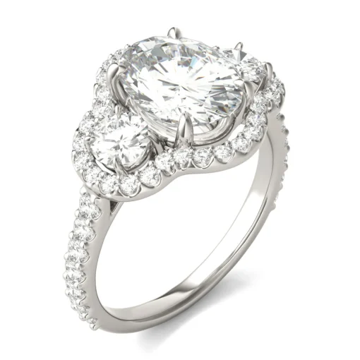 Oval Moissanite Three-Stone Ring With Halo In 14K White Gold
